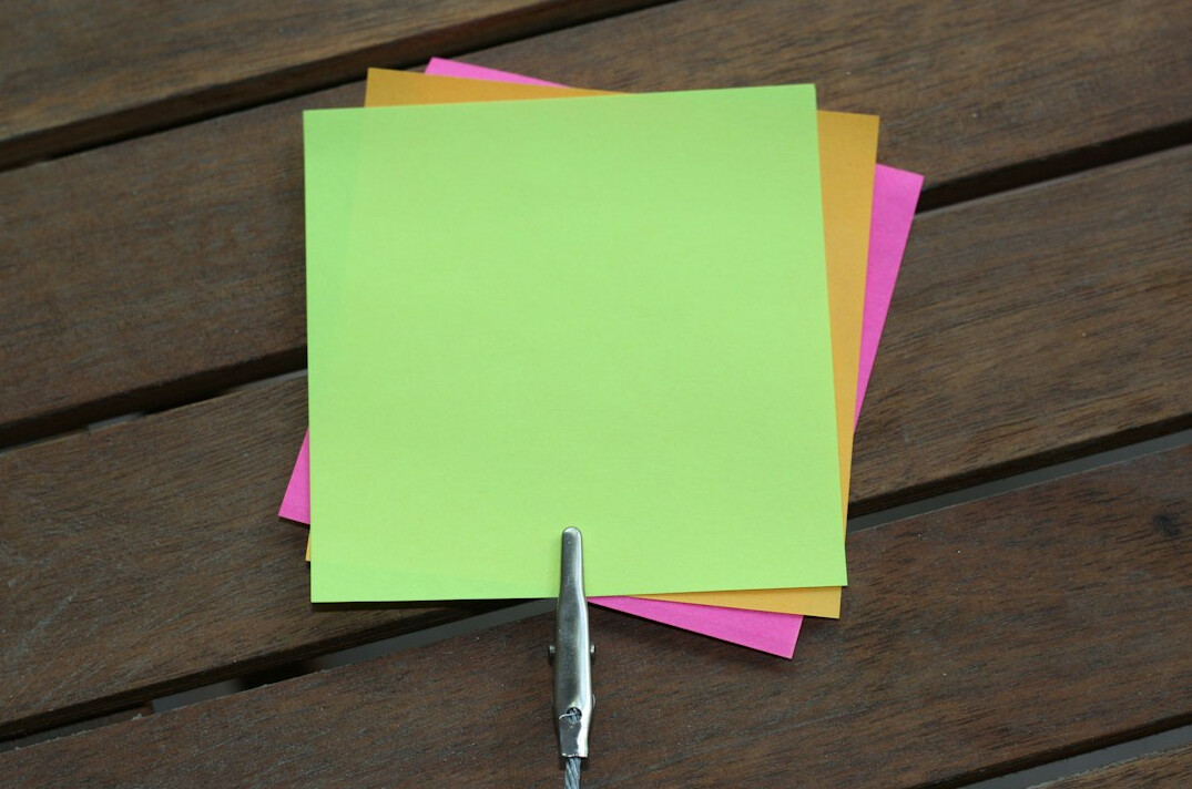 Facilitator leading a collaborative workshop with sticky notes